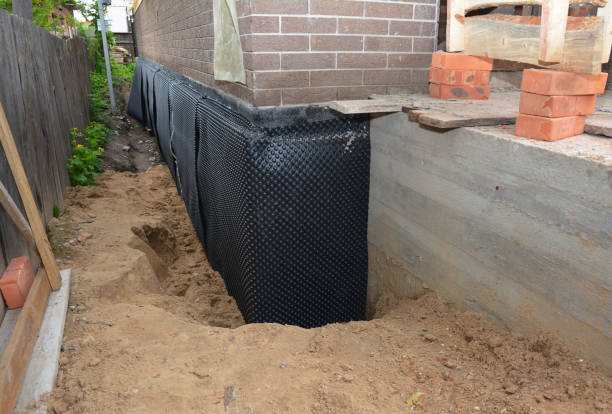 SJ Waterproofing Pros technician performing targeted Emergency Waterproofing assessment in Wanatah, IN